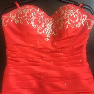 Custom red ruched beaded and embroidered prom dress.